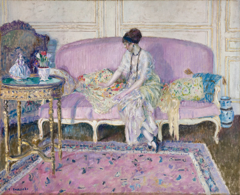 Woman sitting on a sofa indoors - Frederick Carl Frieseke