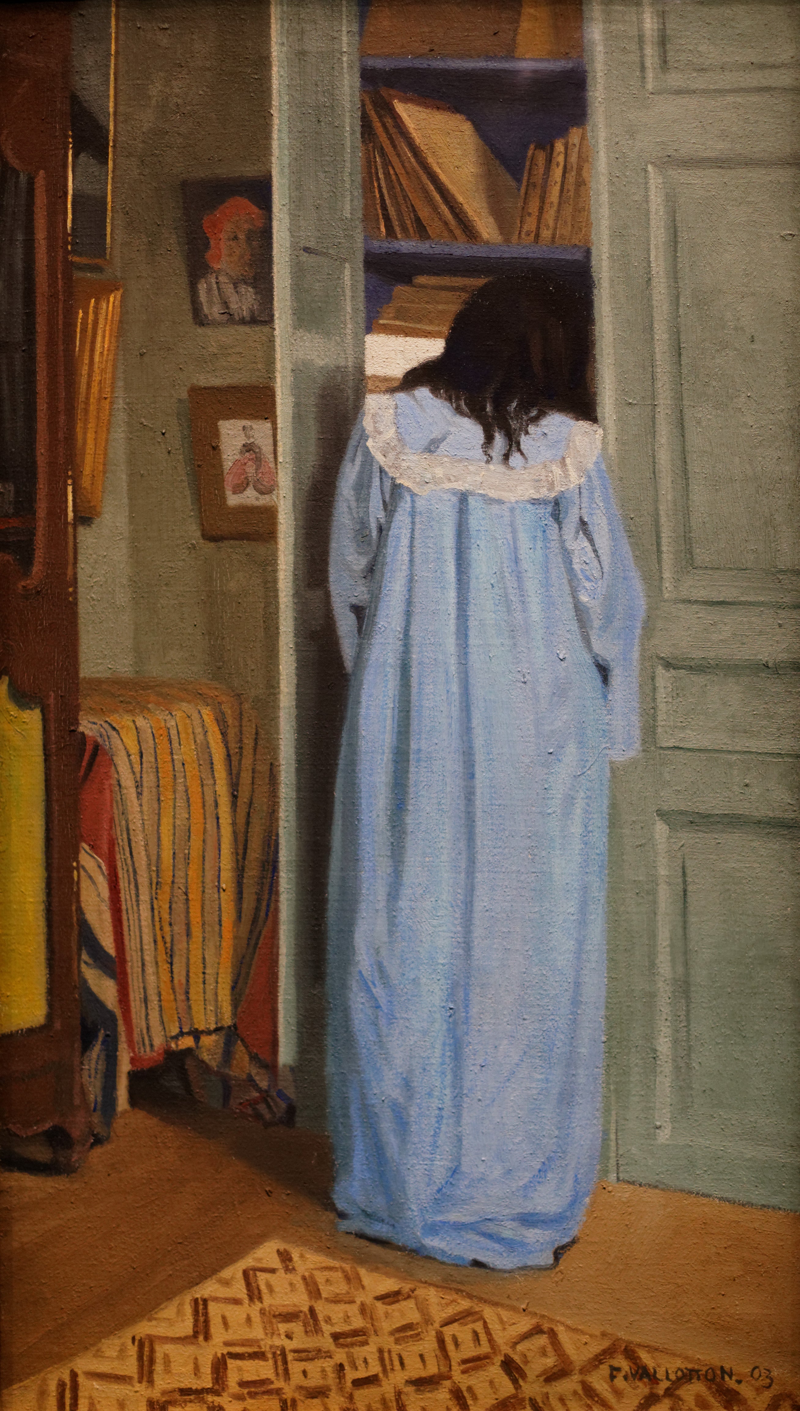 Interior, woman in blue rummaging in a wardrobe - Félix Vallotton